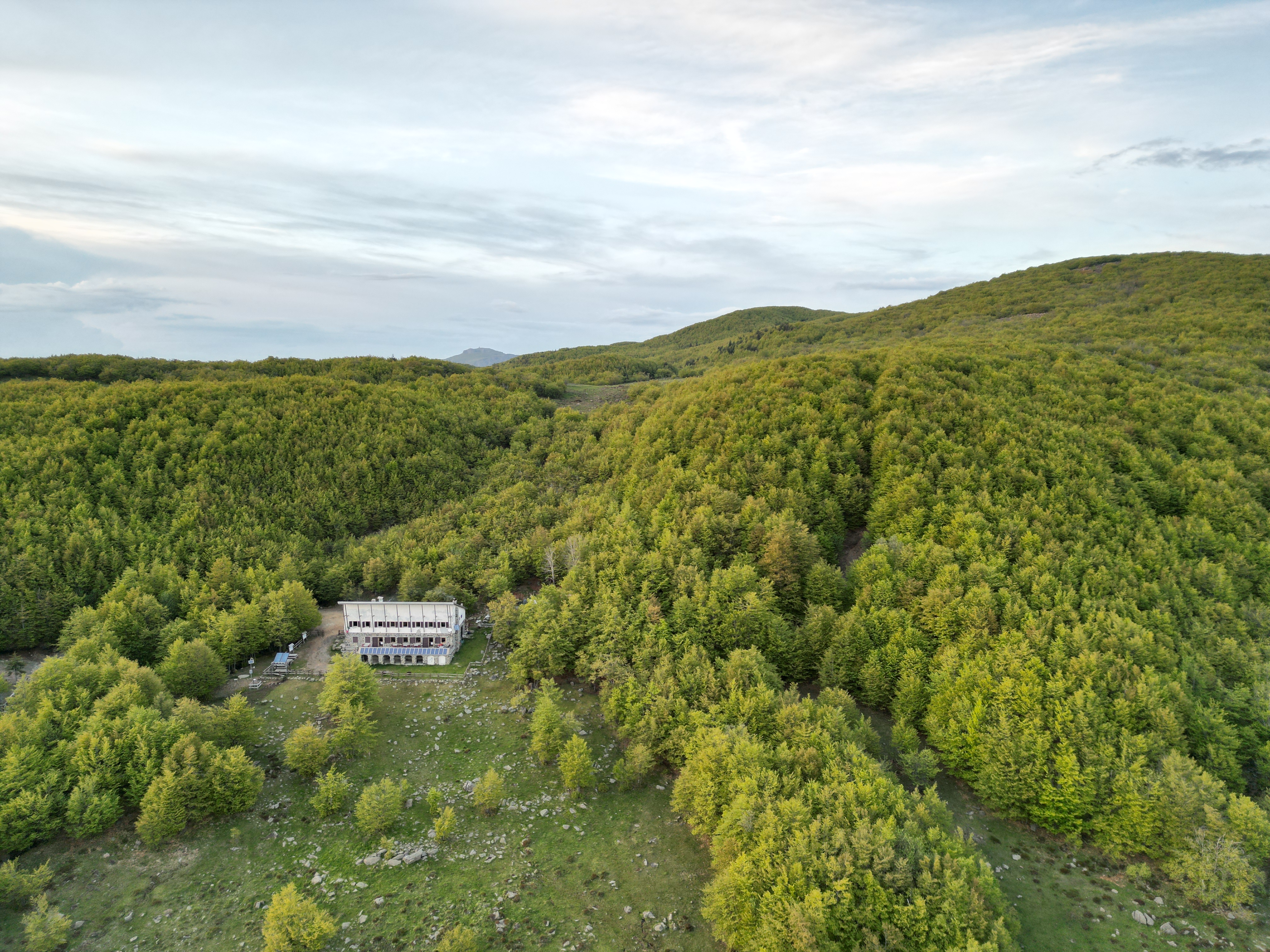A drone shot of the rifugio with the Monte Aiona Plateau clearly visible in the background